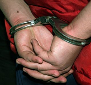 Doi ofiteri de la crima organizata, condamnati pentru mita