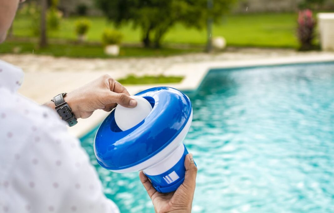 pool-float-chlorine-tablets-pool-maintenance-hands-holding-pool-chlorine-dispenser.jpg